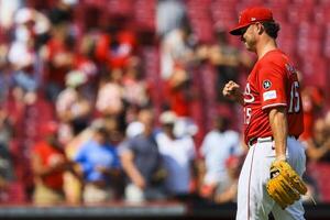 Cincinnati Reds relief pitcher Emilio Pagan (15) reacts after the victory over the Colorado Rockies at Great American Ball Park. editorial_image