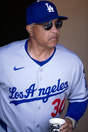 Los Angeles Dodgers manager Dave Roberts (30) arrives in the dugout before taking on the San Francisco Giants at Oracle Park. editorial_image