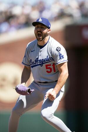 Los Angeles Dodgers pitcher Alex Vesia (51) reacts to striking out the side against the San Francisco Giants during the eighth inning at Oracle Park. editorial_image