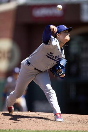 Los Angeles Dodgers starting pitcher Yoshinobu Yamamoto (18) delivers a pitch against the San Francisco Giants during the sixth inning at Oracle Park. editorial_image