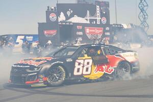 NASCAR Cup Series driver Shane van Gisbergen (88) celebrates by doing a burnout after winning the NASCAR Toyota / Save Mart 350 at Sonoma Raceway. editorial_image
