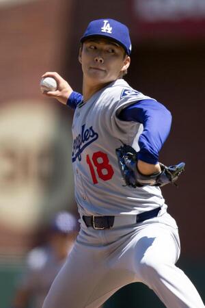 Los Angeles Dodgers starting pitcher Yoshinobu Yamamoto (18) delivers a pitch against the San Francisco Giants during the sixth inning at Oracle Park. editorial_image