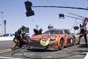 The pit crew for NASCAR Cup Series driver Ross Chastain (1) work on the vehicle at Sonoma Raceway. editorial_image