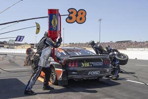 The pit crew for NASCAR Cup Series driver Zane Smith (38) work on the vehicle at Sonoma Raceway. editorial_image