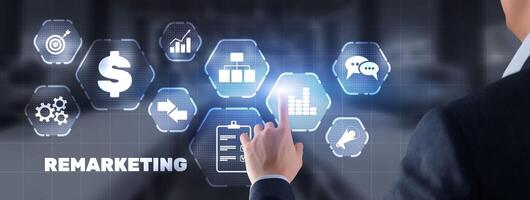 Remarketing digital marketing concept. Businessman presses remarketing on virtual screen photo