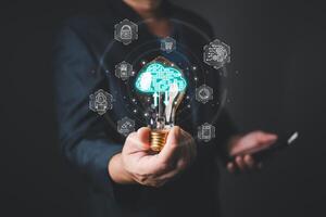 A glowing lightbulb represents innovation in cloud technology, showcasing its impact on digital transformation,business strategy,and the integration of advanced tools to enhance efficiency and growth. photo