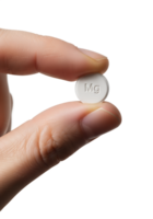 Close-up of hand holding white magnesium supplement tablet, health and wellness concept, isolated on transparent background, mineral nutrition, dietary supplement png