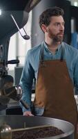 Multiethnic team African Caucasian men experts inspect industrial coffee machine functionality speaking control checklist maintenance tech factory barista equipment manufacture test coffehouse indoor video
