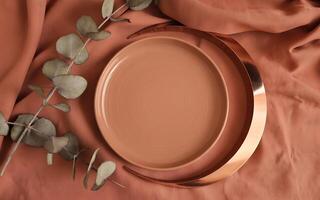 A brown plate with a metal ring on it photo