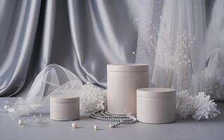 Three white containers with pearls and flowers photo