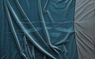 A blue velvet sheet with a striped pattern photo