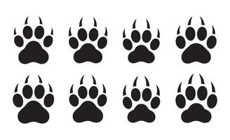 Collection of black animal paw prints with sharp claws on white background vector