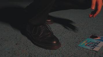 Close-up of Black Shoe and Ticket on Textured Surface video
