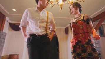 Couple Dancing Under Chandelier in Elegant Setting video