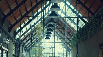 Modern Cafe Interior with High Ceiling and Greenery video
