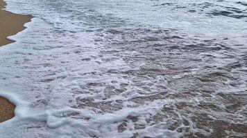 Tranquil Beach Scene with Gentle Ocean Waves and Sandy Shoreline for Relaxation Themes video