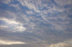 Beautiful blue sky filled with textured cloud photo