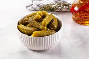 Pickles in a bowl on a table photo