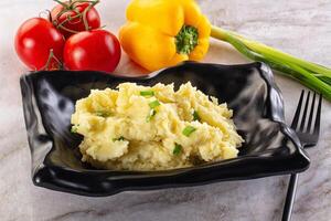 A plate with mashed potatoes and vegetables photo