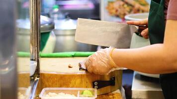 Chef slicing ingredients on a cutting board video