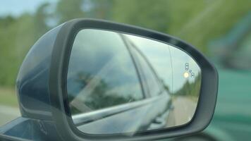 Car side mirror with blind spot warning indicator video
