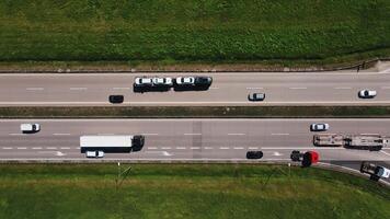 Aerial top down view of highway traffic with freight trucks and cars in motion video