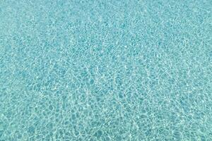 Blue water pool texture pattern summer background ocean vibe tranquil surface sparkling clean sea ripples refreshing tropical scenery vacation mood relaxing environment calm aqua reflection light photo