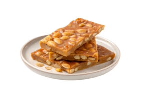 Peanut brittle served on a plate on transparent background png
