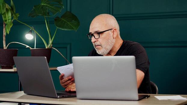 A professional male programmer brainstorms in a modern office. Perfect for themes of innovation, tech development, and collaborative problem-solving photo