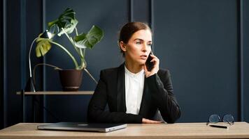 A female accountant or economist working late at the office. Ideal for topics related to finance, night work and professional dedication photo