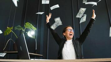 Business lady in office and celebrating money rain, winning or prize in bonus promotion or success in office. Happy and excited employee enjoying money. Happiness for victory or profit of company. photo