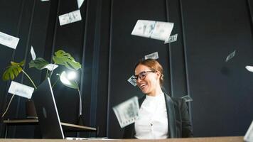 Business lady in office and celebrating money rain, winning or prize in bonus promotion or success in office. Happy and excited employee enjoying money. photo