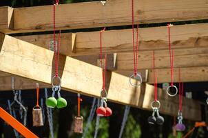 a challenging obstacle course rig with various hanging grips and rings photo