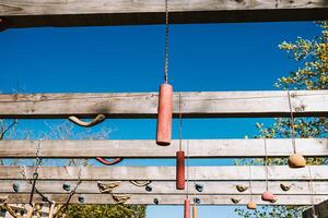 Sunlight on a Wooden Obstacle Course Against a Blue Sky. photo