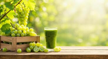 Fresh Juice and Green Grapes on a Sunny Vineyard Table of Wood photo