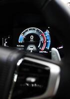 Modern digital screen panel of a car with indications of technical parameters photo