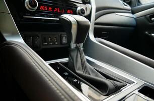 Automatic transmission shift lever inside premium car in parking position photo