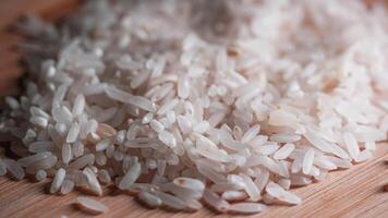 closeup of white rice on wooden table photo