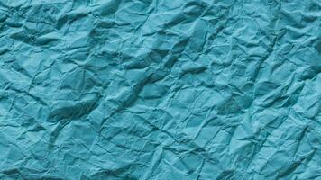 Crumpled Turquoise Paper Texture Background photo