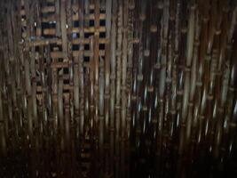 A close up of a bamboo wall with a wooden pattern photo
