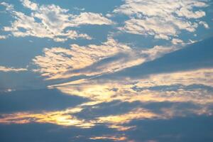 A beautiful sunset with clouds in the sky photo