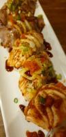 A plate with meat and vegetables on it photo