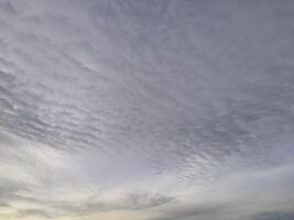 A view of the sky with clouds and a boat photo