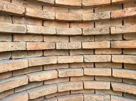 A brick wall with a circular pattern photo