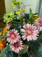 A vase filled with flowers on a table photo