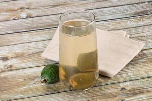 A glass of lemonade with a lemon slice in it photo