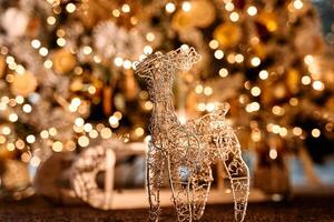 Shimmering wire reindeer sculpture with festive bokeh lights in the background photo