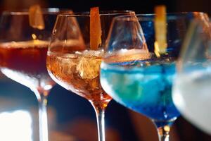 Colorful cocktail array showcasing vibrant mixology and drink diversity at a bar setting photo