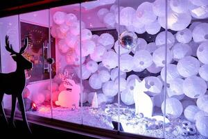 Enchanting winter display with lanterns and silhouettes of deer, rabbits, and foxes photo