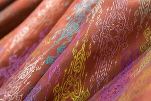 A close up of a colorful patterned fabric photo